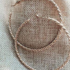 Large braided gold earrings.